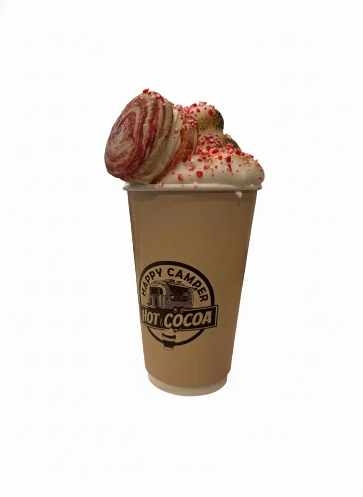 Christmas Confection hot cocoa with a locally made peppermint macaron and festive sprinkles